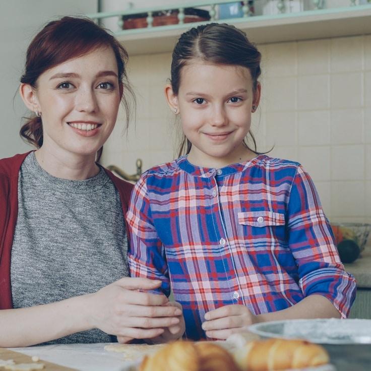 Kaveri Mehta, Lead Design Curator at GoldenMeadowRow, reviewing corporate floral arrangements